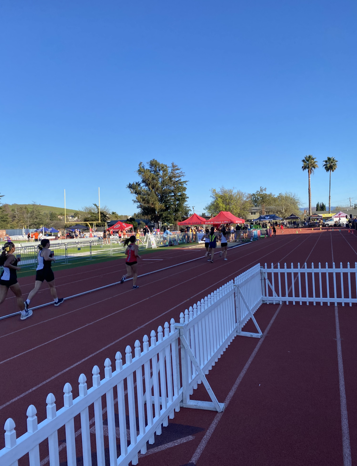 The Dublin Track & Field meet — red lanes, palm trees, and the whole season's energy in one afternoon