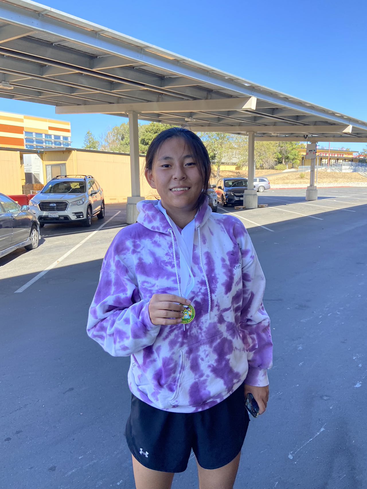 A medal, a smile, and a lot of miles in the legs